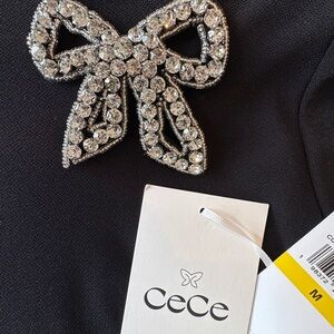 NWT CeCe Black Short Sleeve Top with Embellished Bow